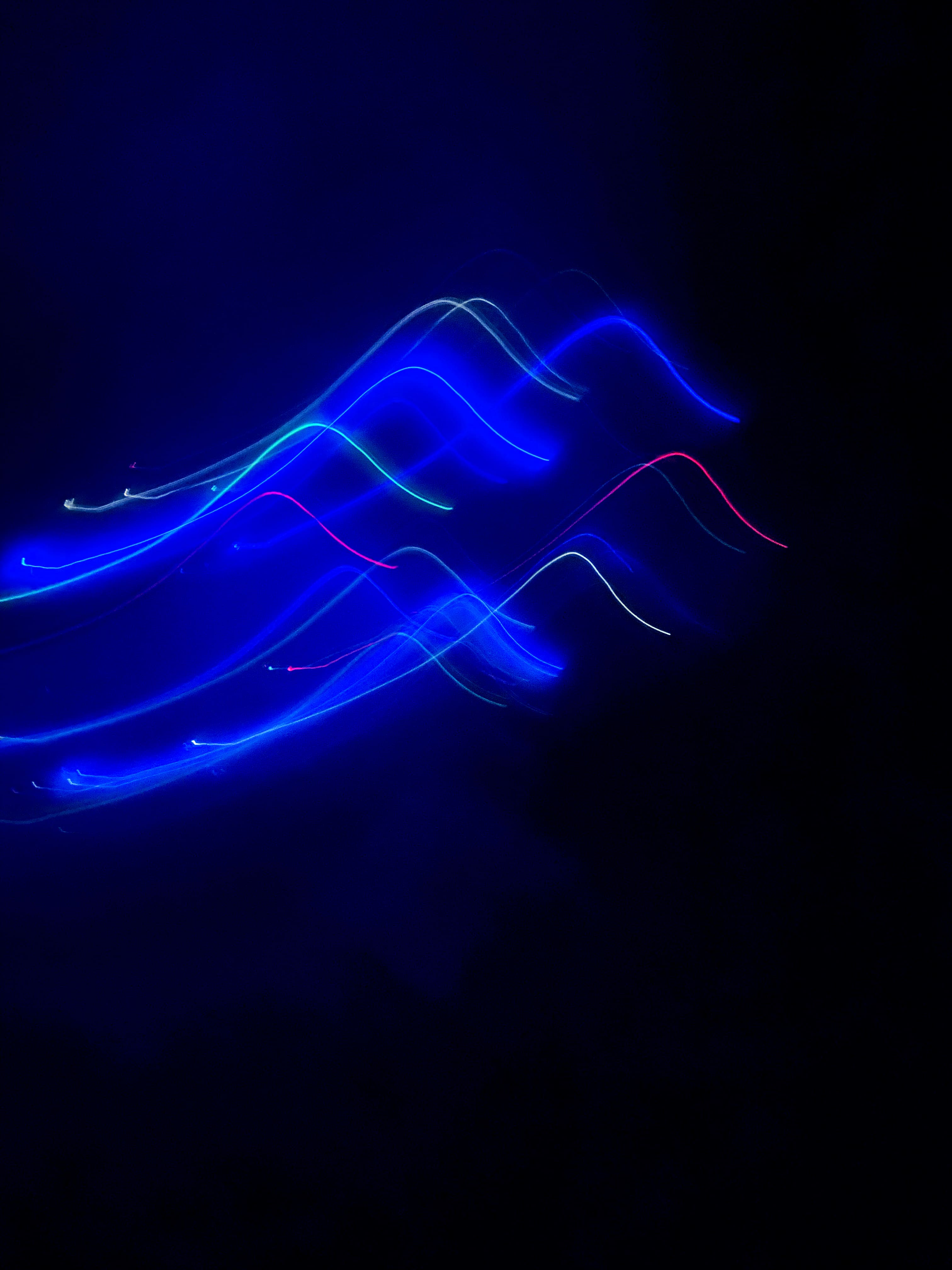 a blurry photo of a blue light in the dark